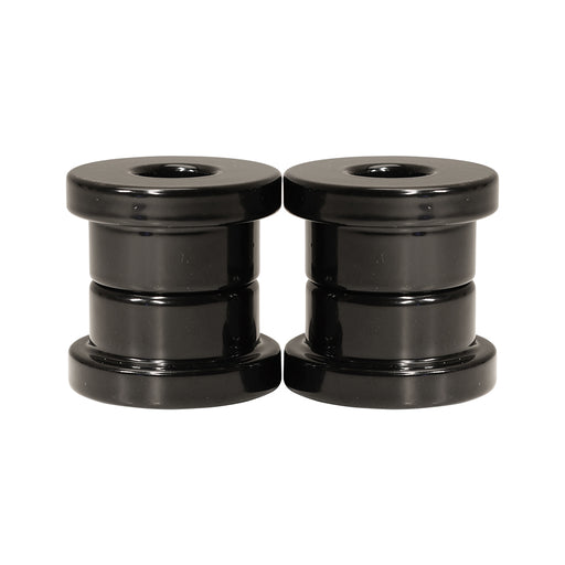 Black riser bushings stacked on top of each other