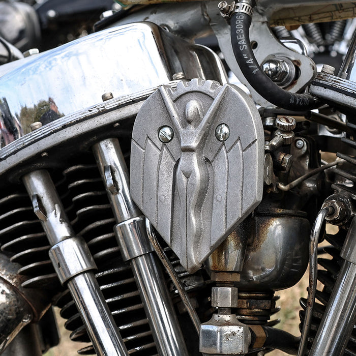 Close-up of a motorcycle engine with visible branding