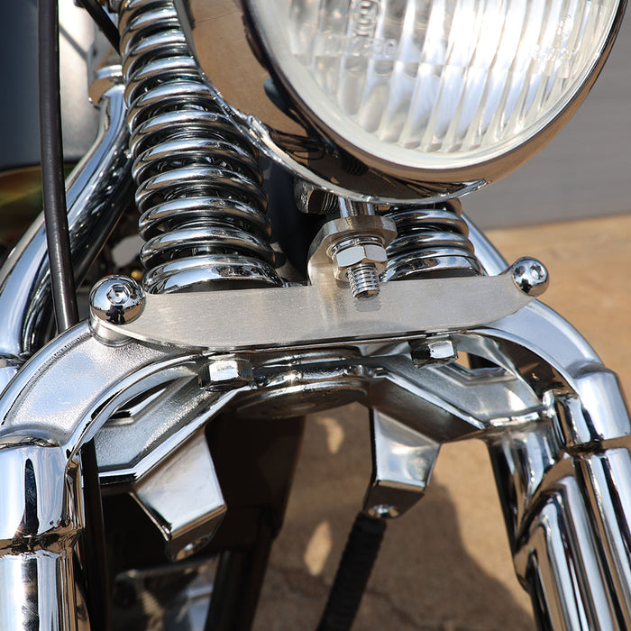 Close-up of a motorcycle headlight and chrome details