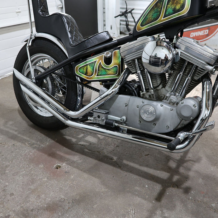 Motorcycle engine and exhaust system on a concrete floor