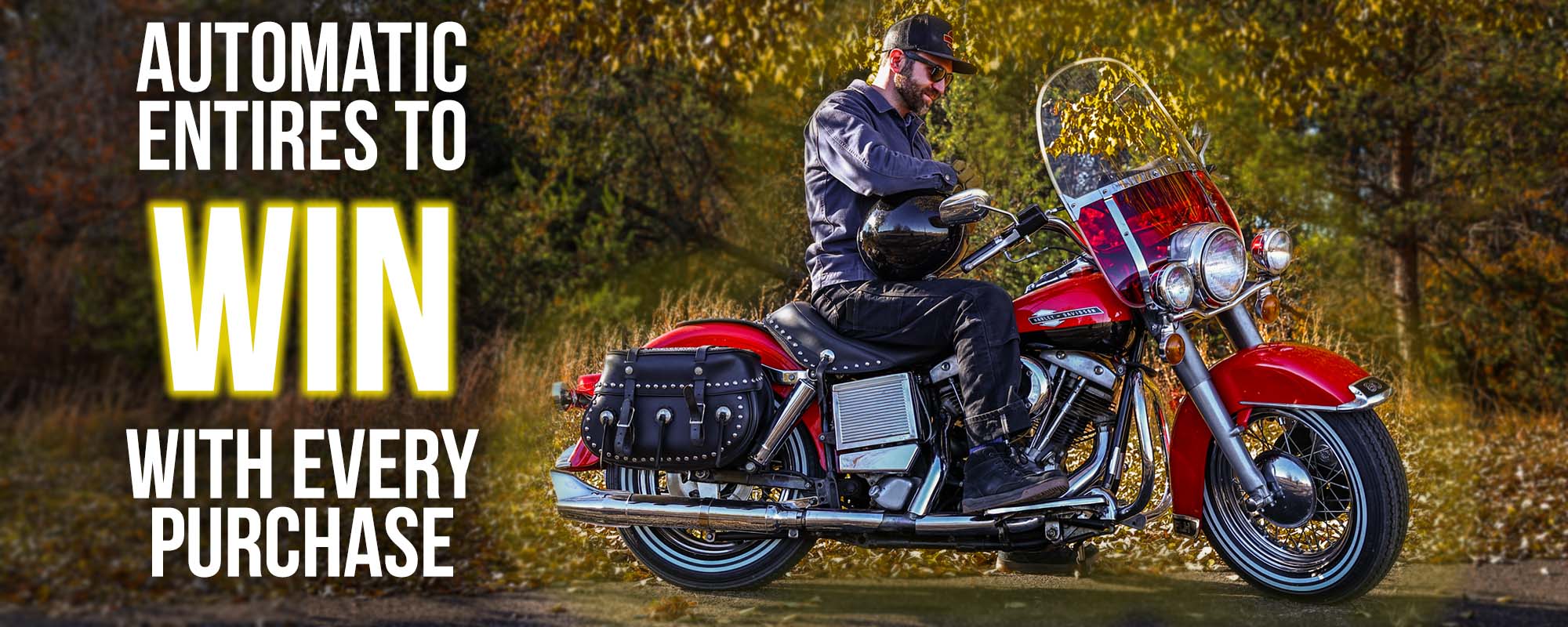 Seth sitting on red motorcycle in front of leaves automatic entries to WIN with every purchase