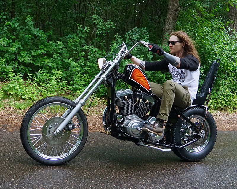 Long Haired Man Riding Sportster chopper Motorcycle 