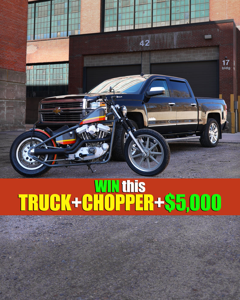 Win this truck and chopper in front of brick buildings