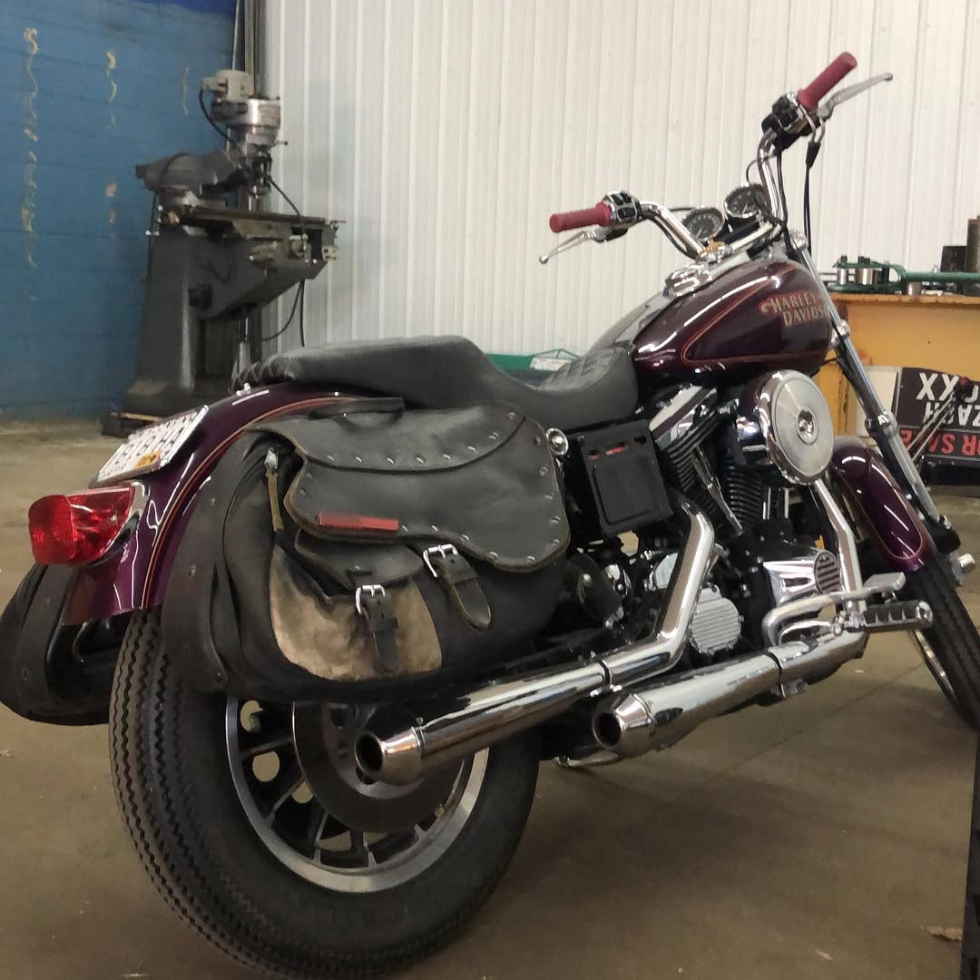 Motorcycle with saddlebag in a garage setting