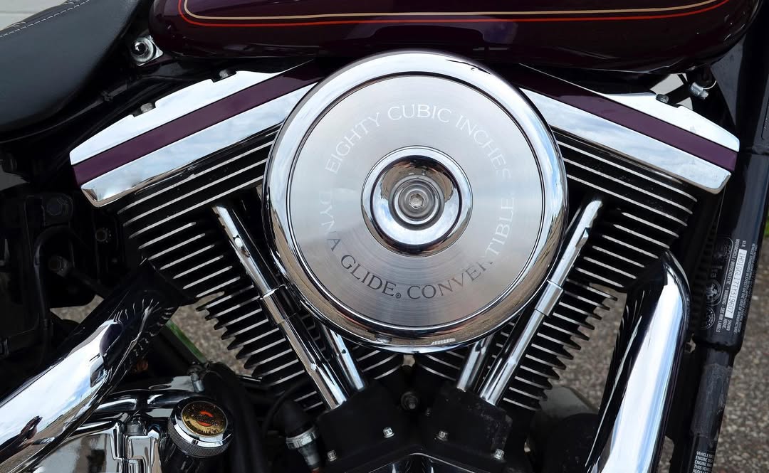 Close-up of a motorcycle engine with 'Harley-Davidson' branding.