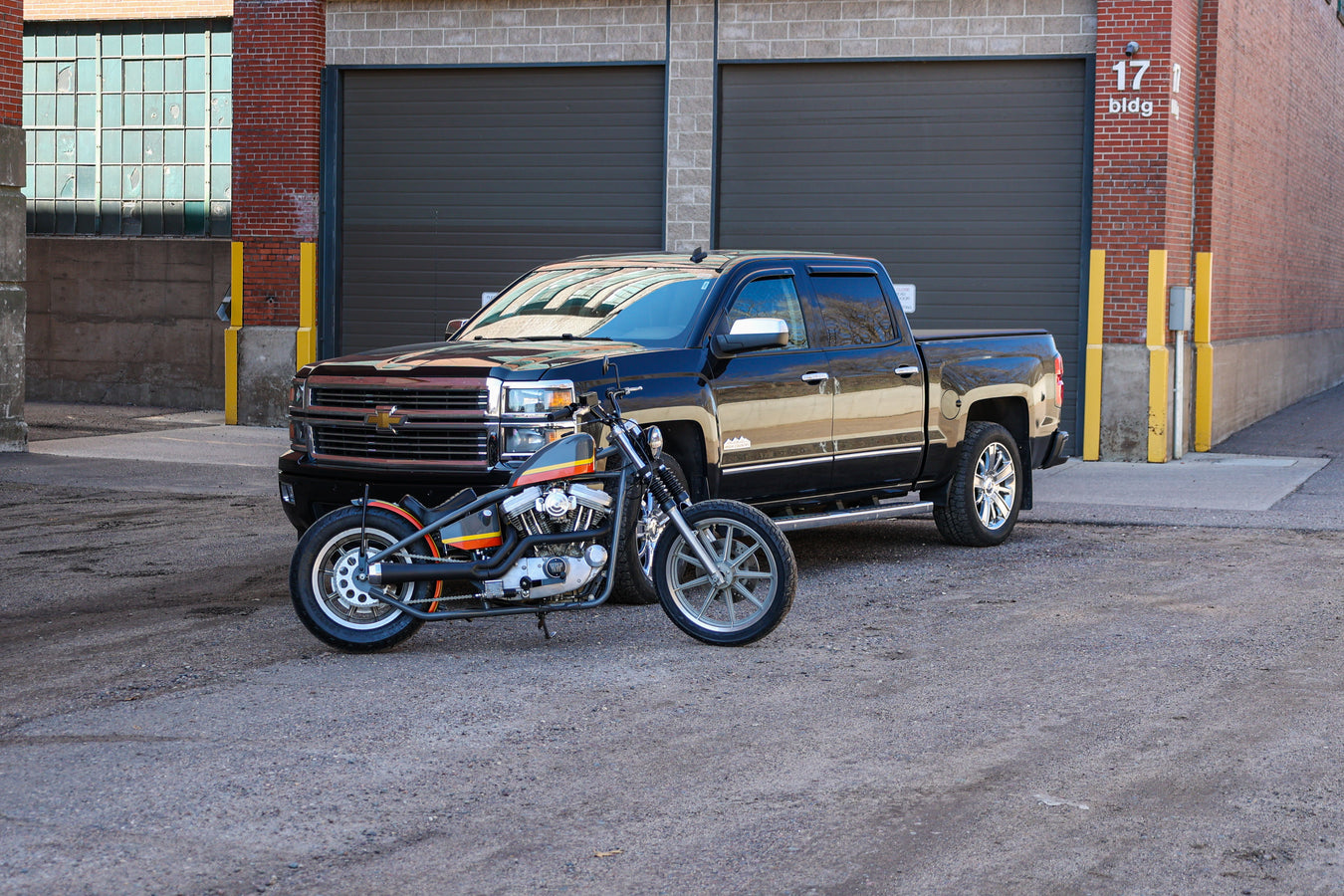 Truck and bike in front of garage doors