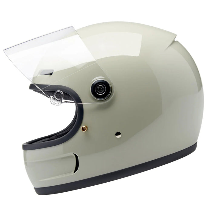 gray motorcycle helmet with clear visor on a white background