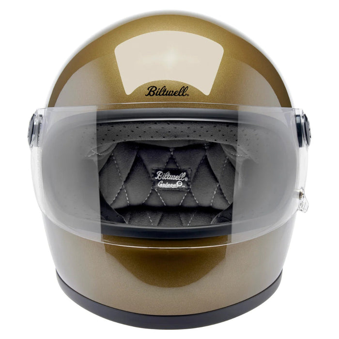 Gold helmet with clear visor featuring Biltwell logo on a white background