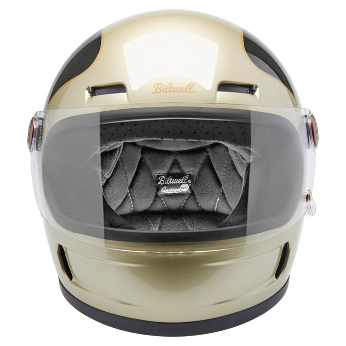 Champagne and charcoal motorcycle helmet with clear visor on a white background