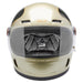 Champagne and charcoal motorcycle helmet with clear visor on a white background