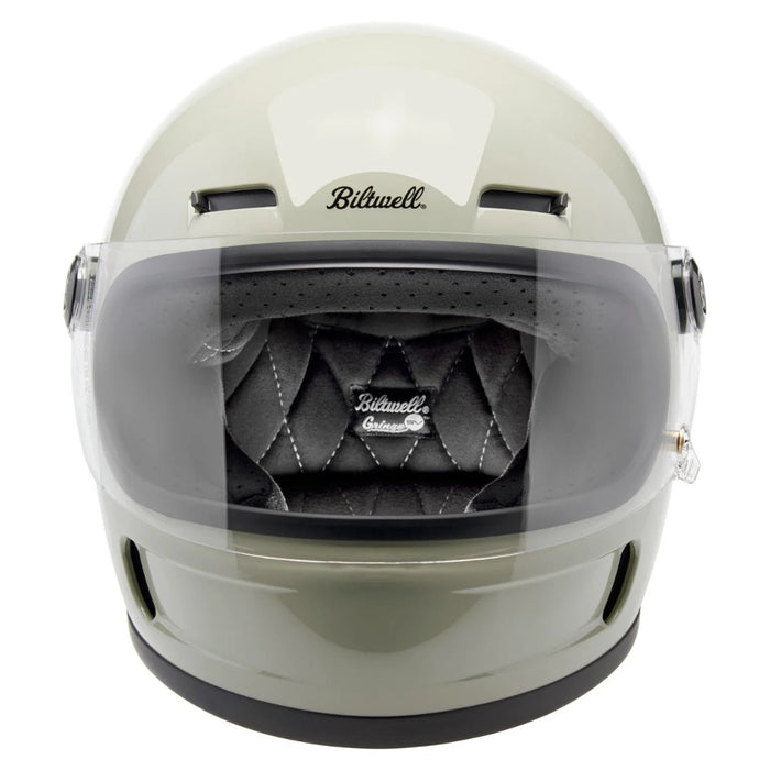 gray motorcycle helmet with clear visor on a white background