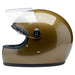 Gold motorcycle helmet with clear visor on a white background