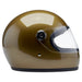 Gold motorcycle helmet with clear visor on a white background