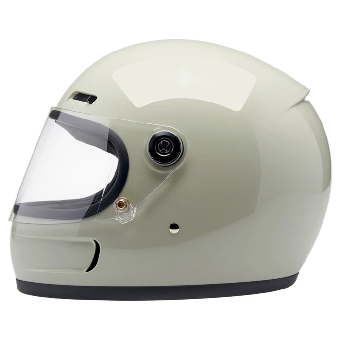 Gray motorcycle helmet with clear visor on a white background