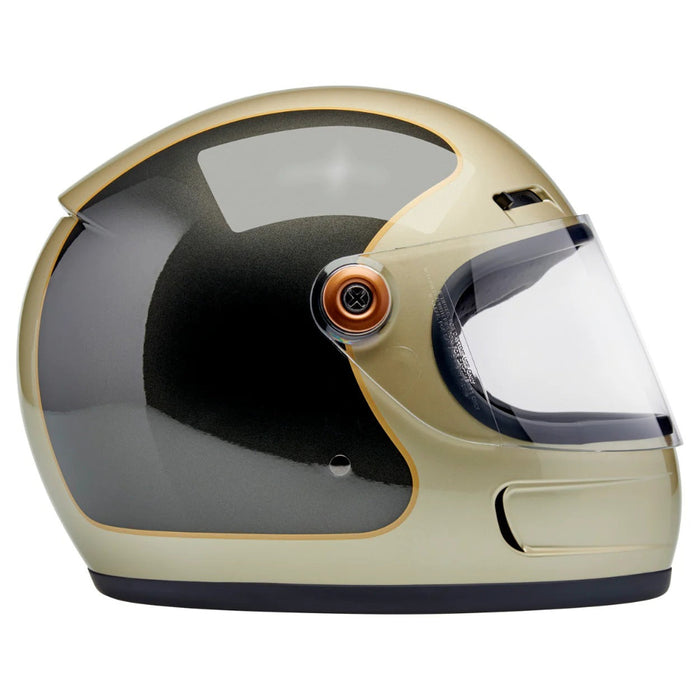 Champagne and charcoal motorcycle helmet with clear visor on a white background