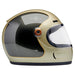 Champagne and charcoal motorcycle helmet with clear visor on a white background
