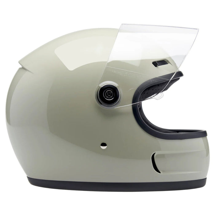 gray motorcycle helmet with clear visor on a white background