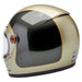 Champagne and charcoal motorcycle helmet with clear visor on a white background