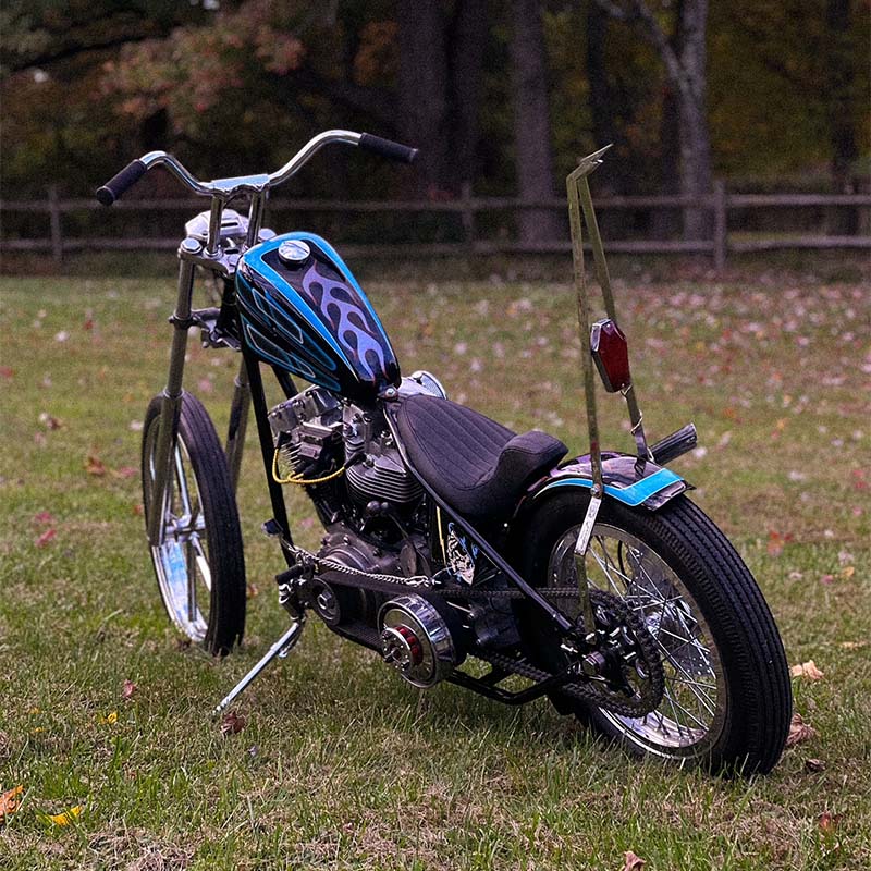 shovelhead chopper with purple flames and throttle addiciton hardtail kit