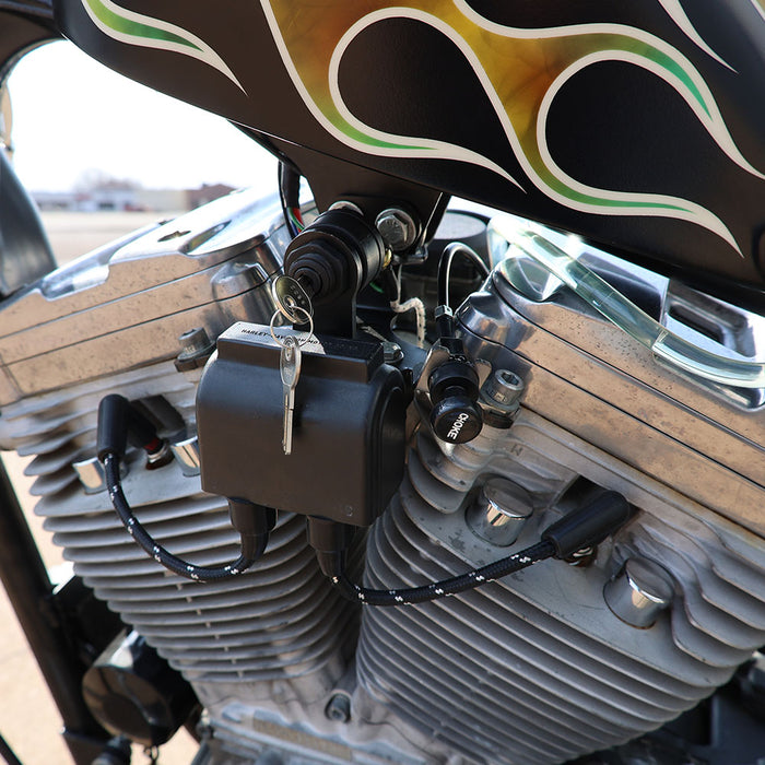 Close-up of a motorcycle engine with flame design and key lock mechanism.